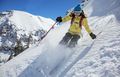 A skier plunges down one of Telluride's scenic runs.