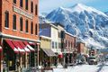 Top: Earn your turns - Telluride Ski Resort is famous for its advanced terrain reachable only by some steep hikes. Left: The town of Telluride has an authentic historic charm amid spectacular scenery.